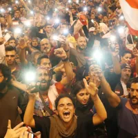 Cel puţin 45 de persoane rănite în ciocniri între forţele de ordine şi manifestaţi anti-lockdown la Tripoli/FOTO: Reuters