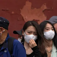 Chinezi purtând mască, pentru a se proteja de Covid - Foto: Profimedia Images - fotografie cu caracter ilustrativ