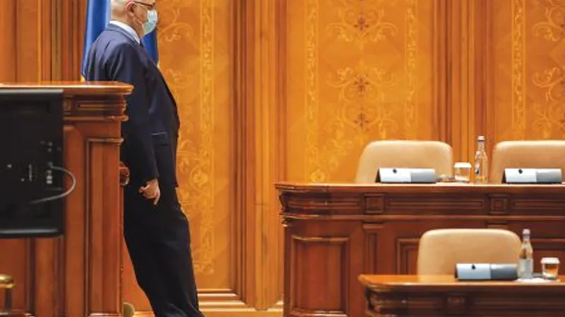 RELAXARE Raed Arafat în Parlament, contemplând prezidiul gol - Foto: INQUAM PHOTOS/ George Călin