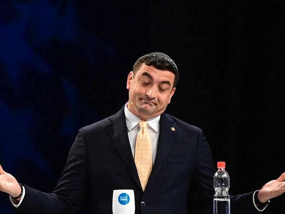 George Simion, expunându-şi teoriile, într-o emisiune televizată - Foto: Profimedia Images