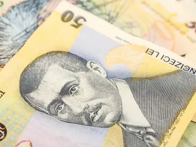 Tot mai mulți români își lichidează depozitele la bănci și mută banii la stat. Care este motivul? - Foto: Profimedia Images (Imagine cu rol ilustrativ)