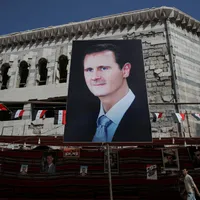 Poster cu Assad în Douma/ Foto: Reuters