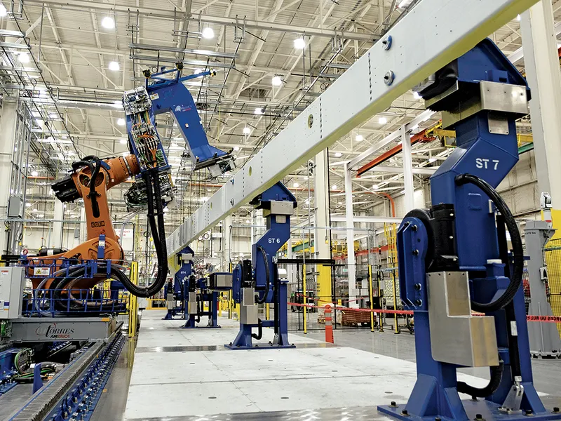 Yang prevede fabrici pline cu „brațe robotizate cât vezi cu ochii“, precum această linie de asamblare de la fabrica Boeing din Washington