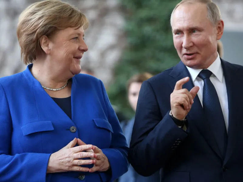 Cancelarul german Angela Merkel şi preşedintele rus Vladimir Putin. Foto: Getty Images