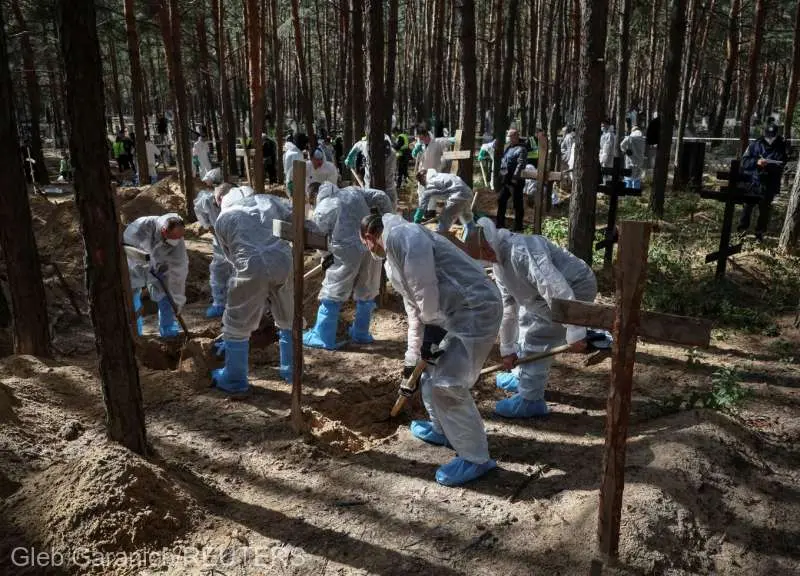 Groapa comună de la Izium - Foto: Gleb/Reuters