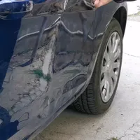 Ţi-a înfundat portiera de la maşină un alt şofer? Trucul simplu prin care poţi să o repari singur - Foto: captură video Facebook/PDR Cluj-Napoca reparatii indoituri/grindina