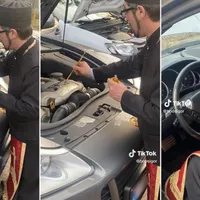 Un preot sfințește caii unui Porsche Cayenne făcând cruci cu mir pe motorul V8. / Foto: dobrogea.tv