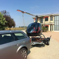 Poliția germană a descoperit doi români care transportau un elicopter folosind o remorcă auto/FOTO: cochettrailer.uk