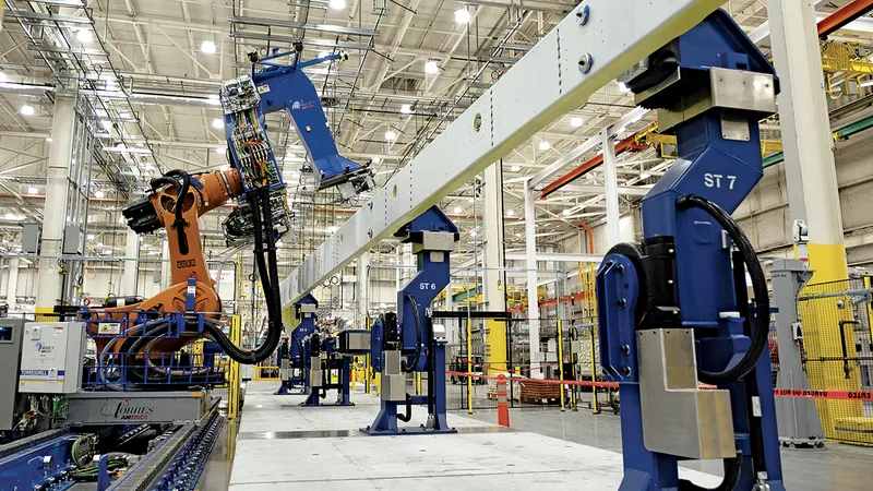Yang prevede fabrici pline cu „brațe robotizate cât vezi cu ochii“, precum această linie de asamblare de la fabrica Boeing din Washington