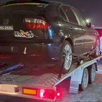 Mașina de curse a lui Sorin Telehoi transportată pe platformă. - Foto: gsp.ro