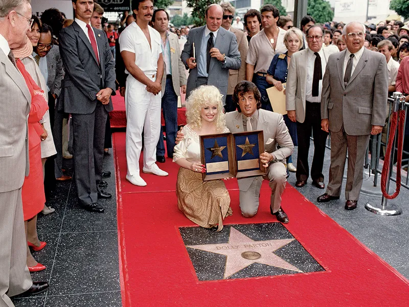 Parton și Sylvester Stallone au primit stele pe Hollywood Walk of Fame în 1984