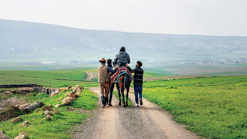 Daxil Aido, 46 de ani, are o lecție de călărie la centrul ecvestru Horses for Hope