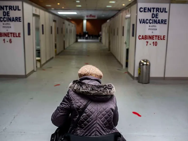 Woman waiting to receive the Pfizer-BioNTech COVID-19 vaccine at Romexpo in Bucharest, Romania Photo: Mugur VARZARIU/Getty Images/Newsweek