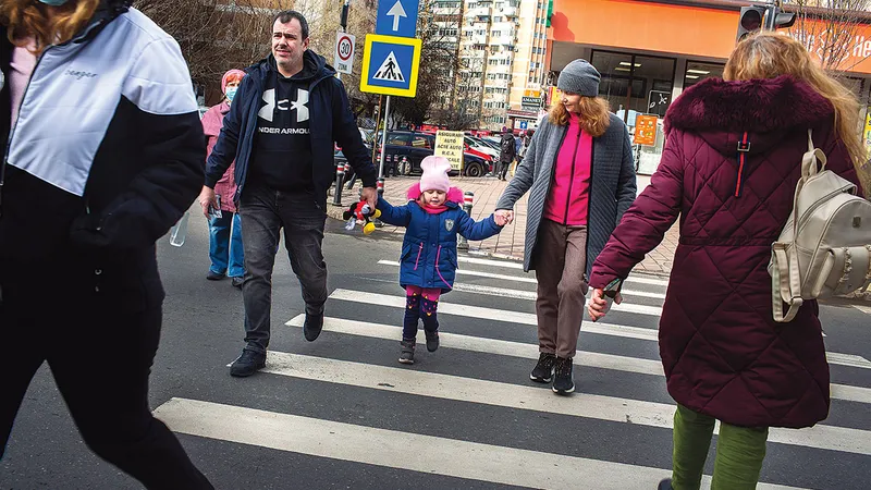 Mihai Oprescu, și el tată de fete, împrună cu Emily și Anatsasiia în București.
