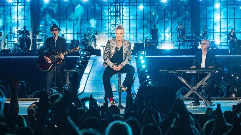Cântăreţul pop Robbie Williams l-a devansat pe Elvis Presley devenind artistul solo cu cele mai multe albume pe prima poziţie în clasamentele din Regatul Unit - Foto: Profimedia Images
