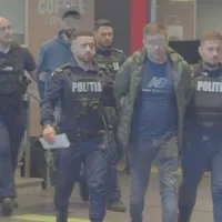 Persoane implicate în scandal, ridicate de polițiști -Foto: Captură video amator